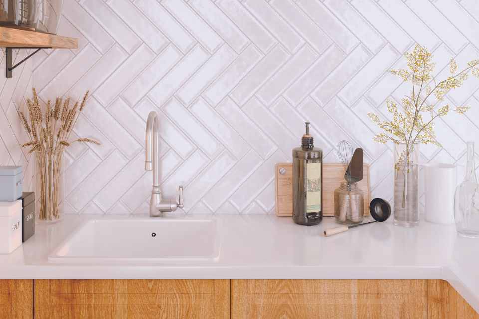 white glossy subway tile inlaid as herringbone backsplash in modern natural kitchen